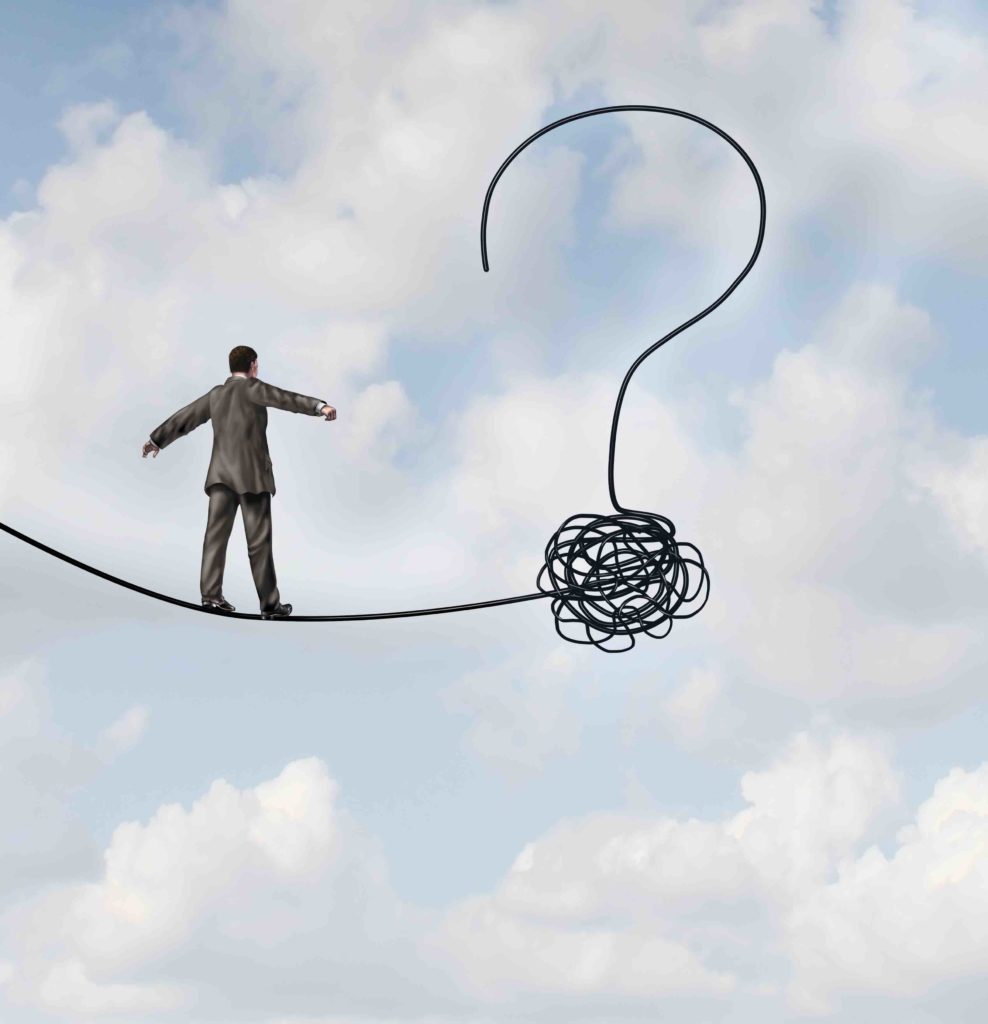 Risk uncertainty and planning a new journey as a businessman walking on a tight rope that getets tangled and shaped as a question mark as a metaphor for confusion at the road ahead as a business concept of finding solutions to change for success.